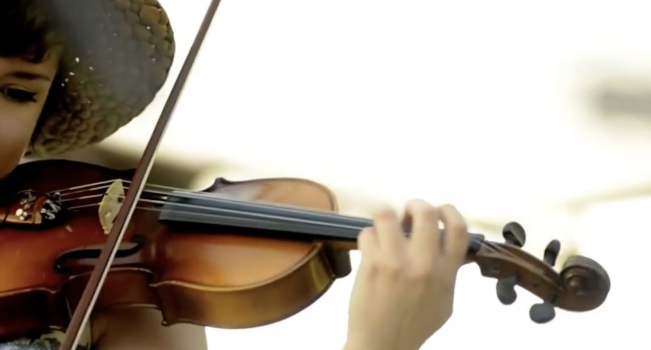 a person playing a fiddle